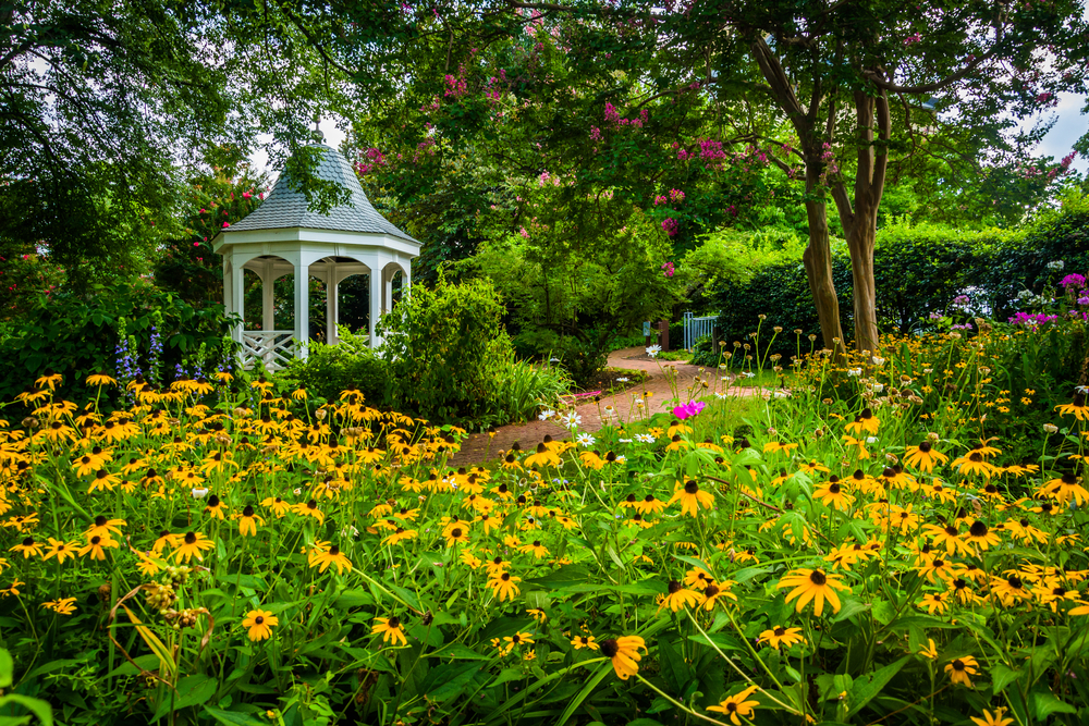 Colorful garden and gazebo in a park in Alexandria, Virginia.
